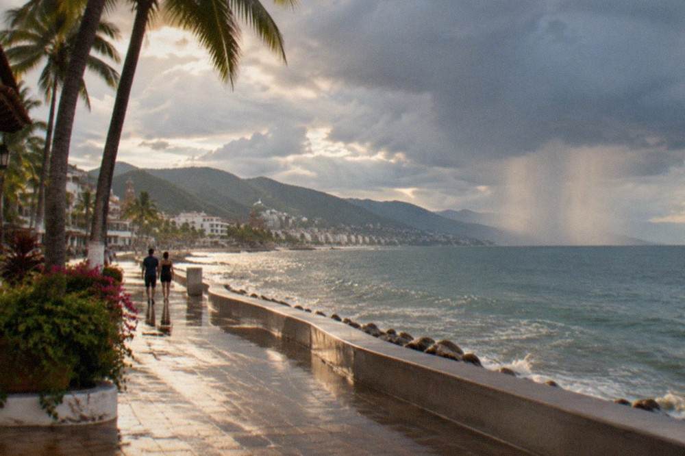 Rain clouds passing over the ocean near the Puerto Vallarta Malecon