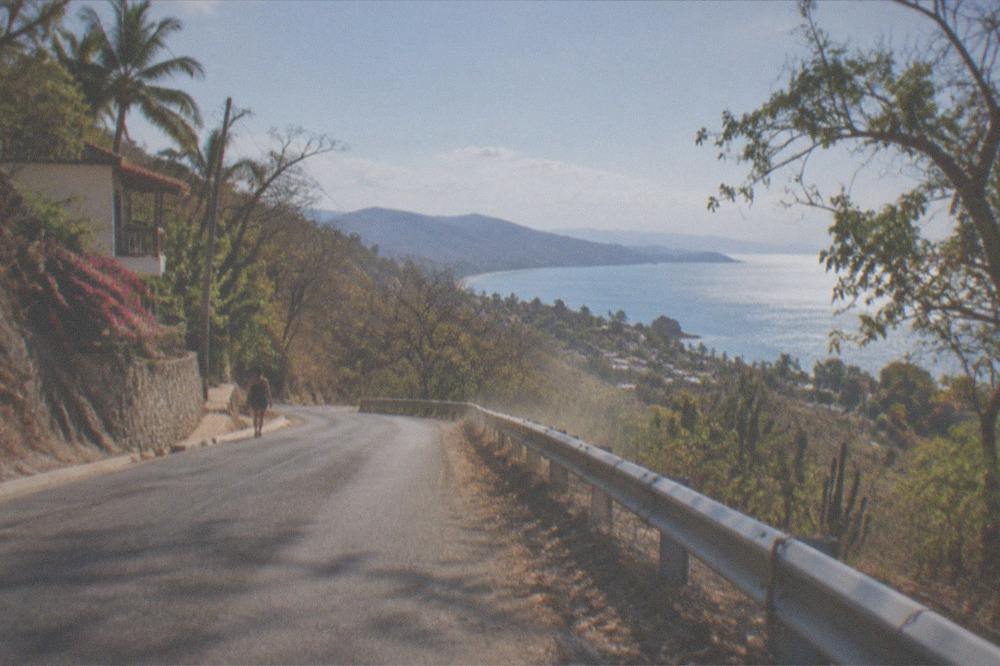 Mountain road above Puerto Vallarta with the bay visible in the distance