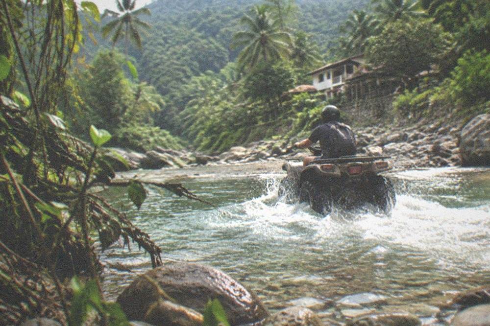 Jungle river crossing with an ATV trail winding through Sierra Madre foothills near Puerto Vallarta
